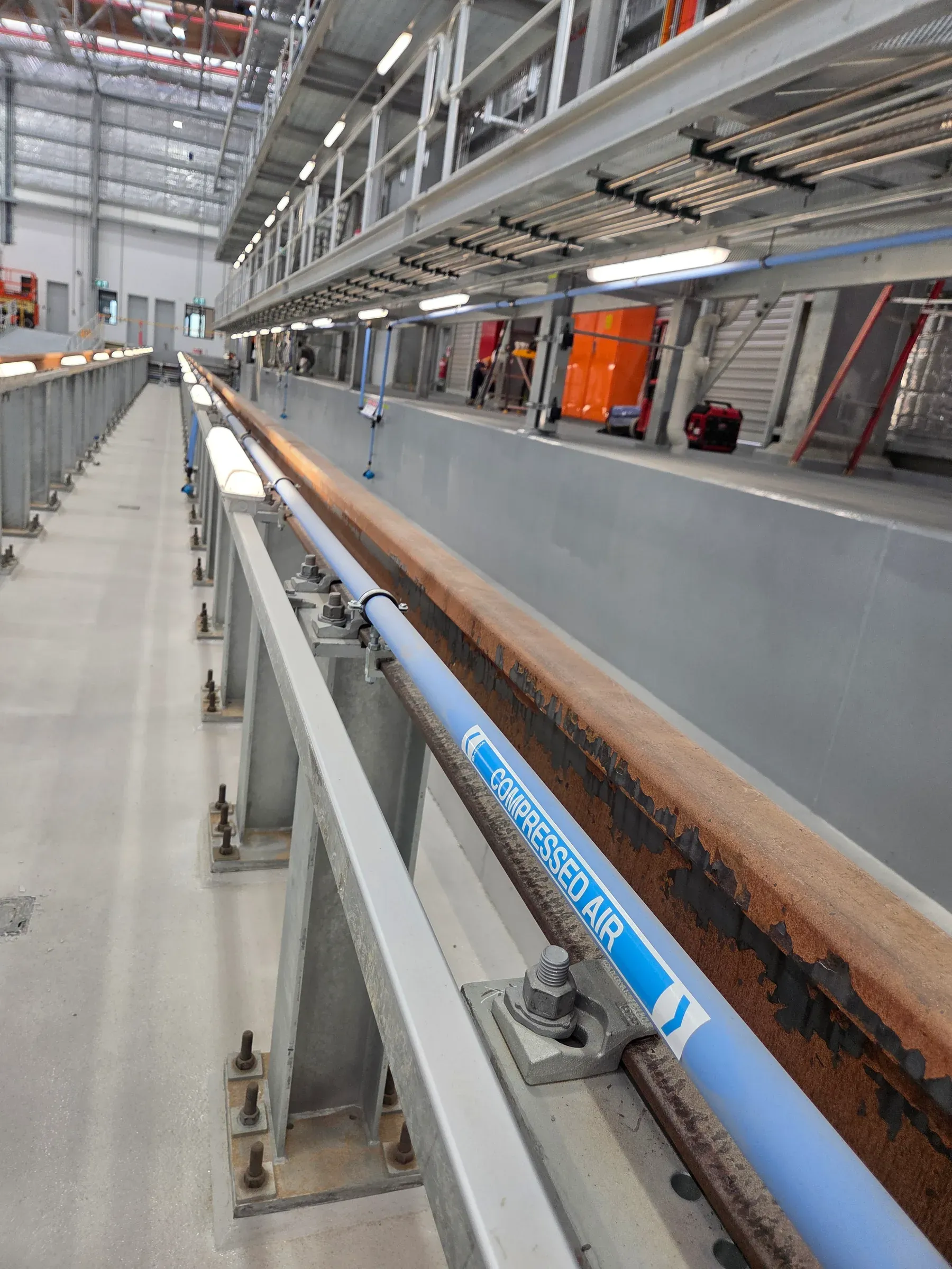 Commercial drainage and pipework installation on a concrete floor