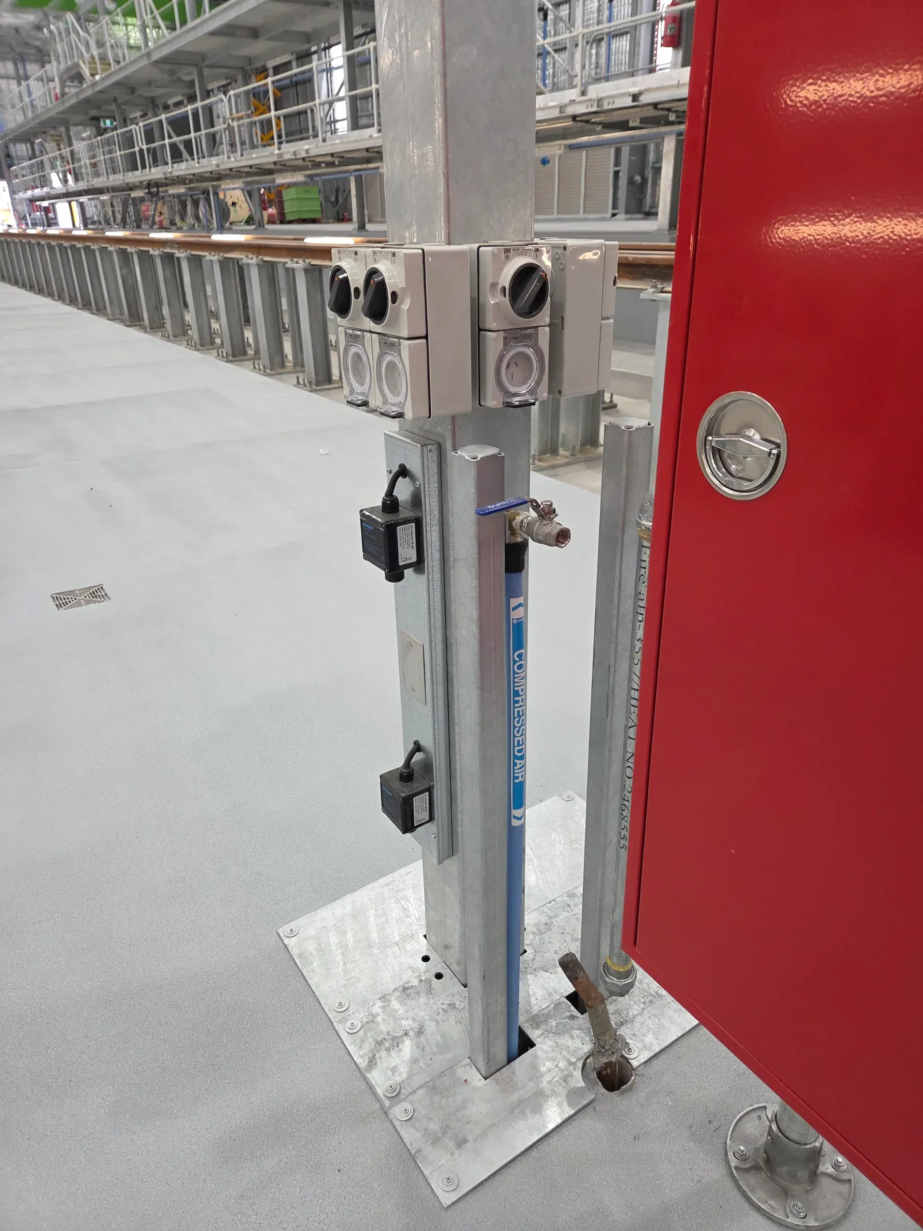 Hydraulic plant room infrastructure with blue tanks and pipework