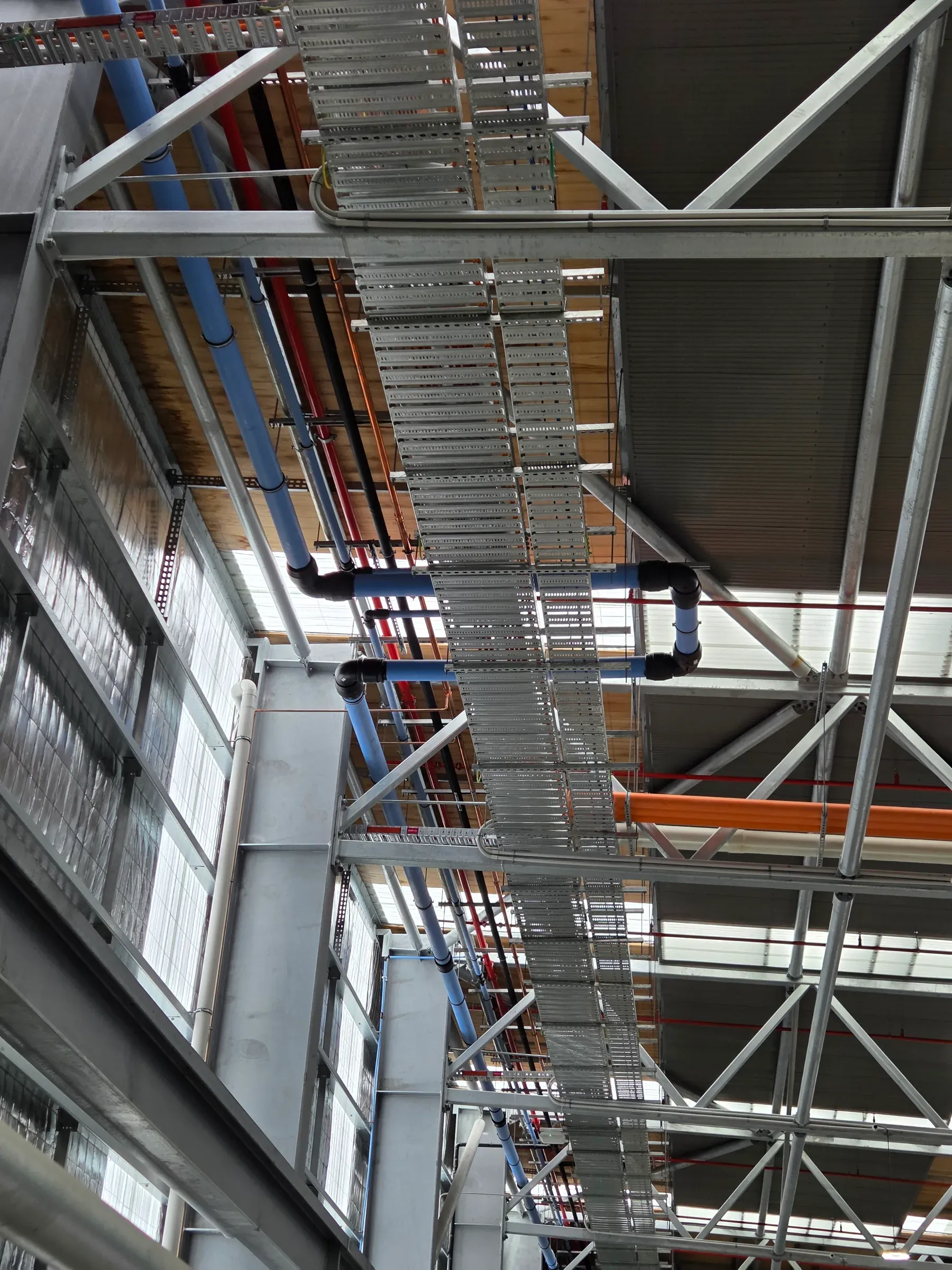 Vertical hydraulic pipework and riser connections on a construction site